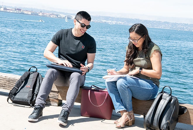 students studying by the water in San Diego
