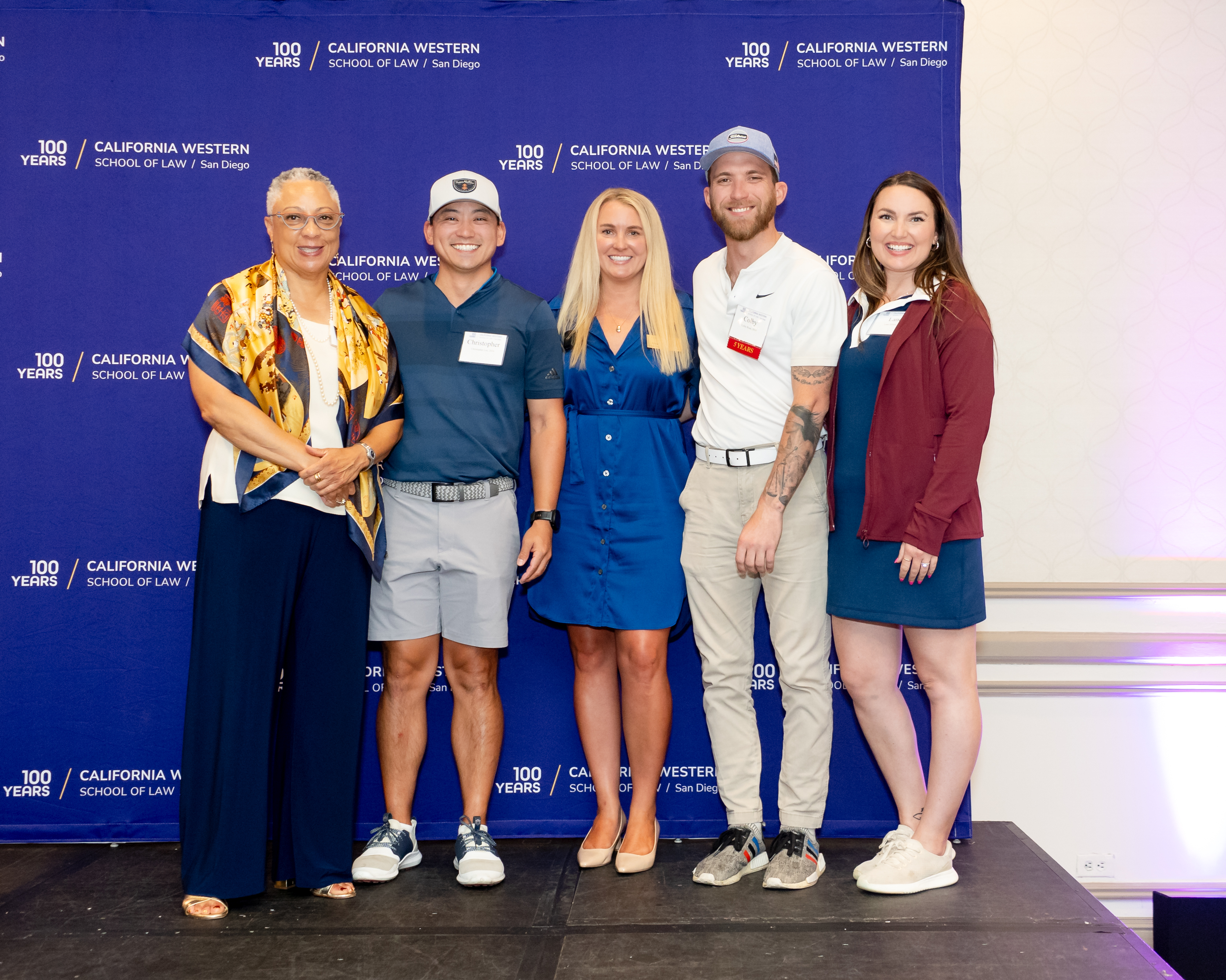 Winners of the golf tournament pose with Dean Sean Scott and Alumni Association Board President Jordan Enright.