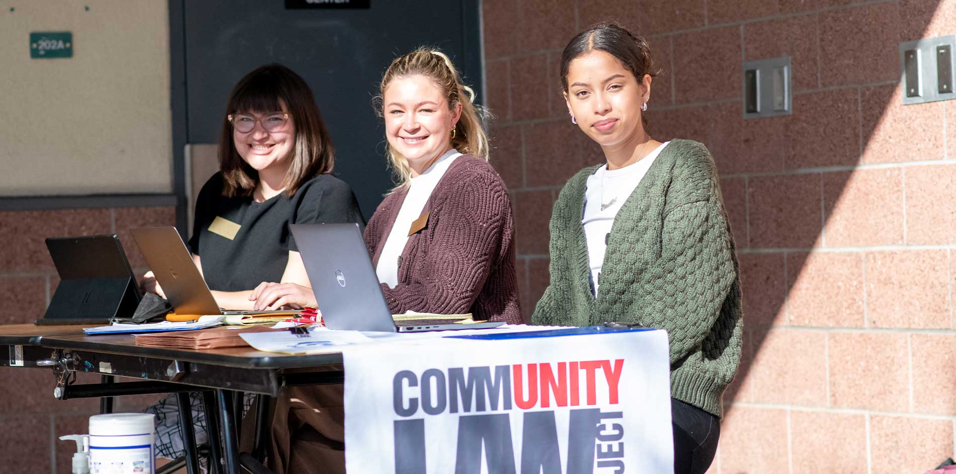 New Media Rights interns working at neighborhood client