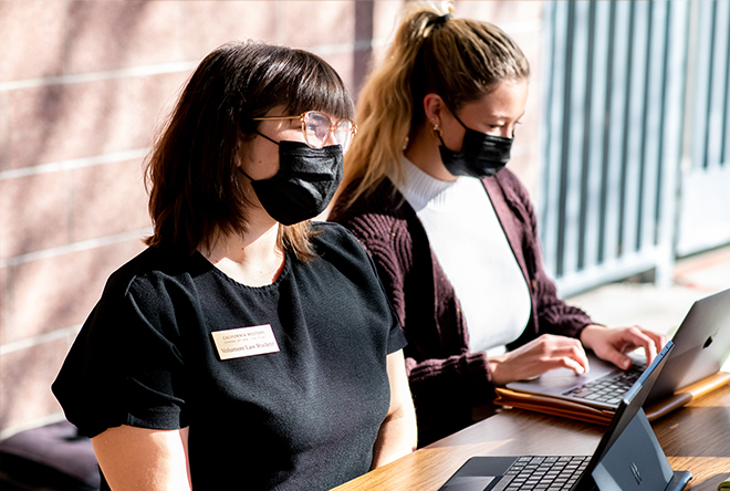 two female student interns working at a legal clinic