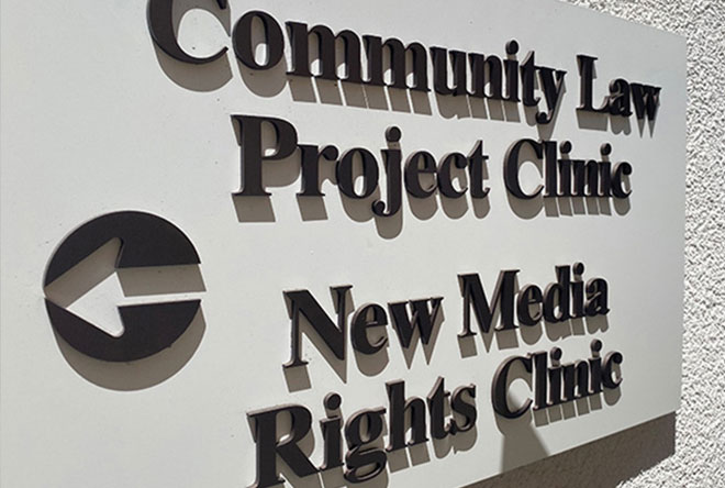 Sign of New Media Rights and Community Law Project in courtyard