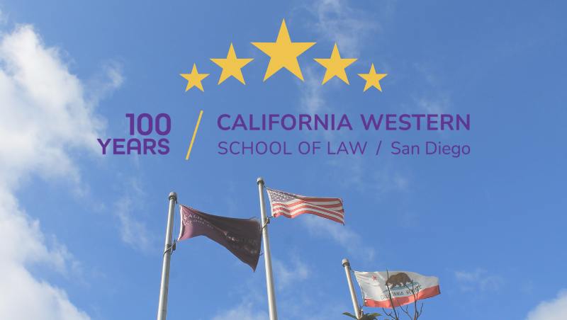 Flags of California Western School of Law, the United States, and California against blue sky.