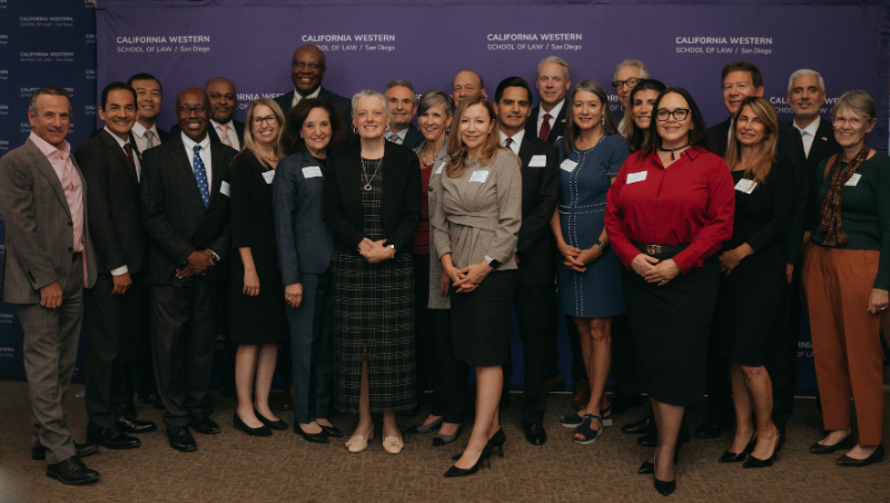 Dean and President & Professor of Law Miriam H. Baer poses for a photo with judges and commissioners.