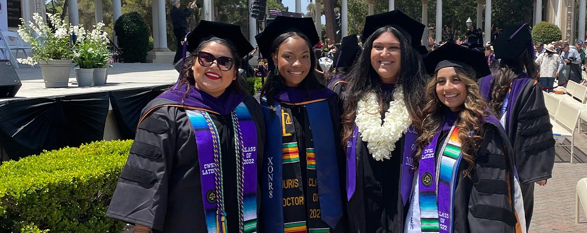 four female students at California Western's Spring 2022 commencement ceremony